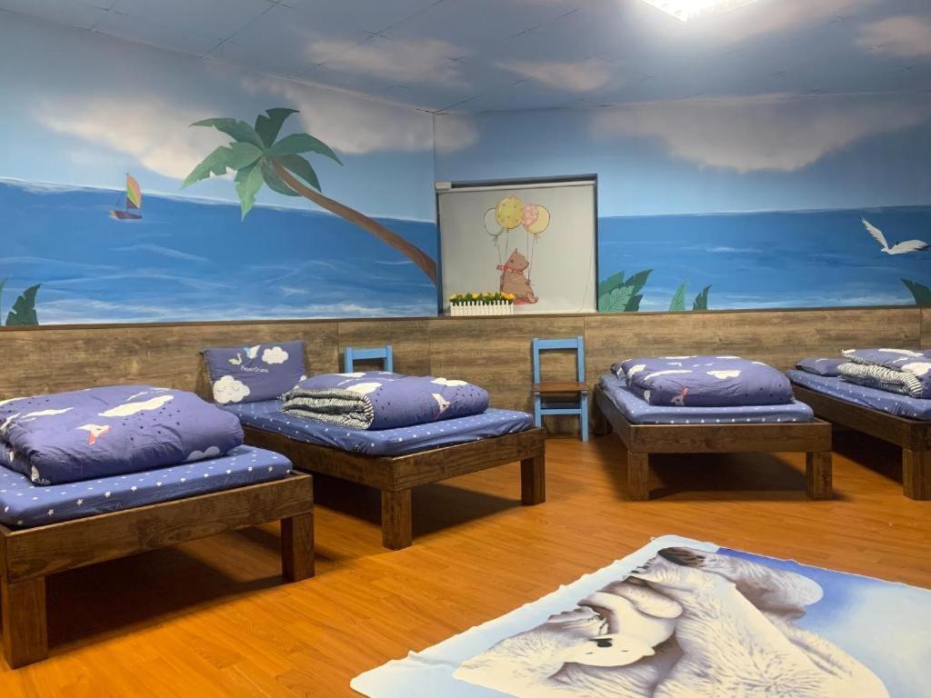 Postel nebo postele na pokoji v ubytování 安禾居 AnHeJu B&B