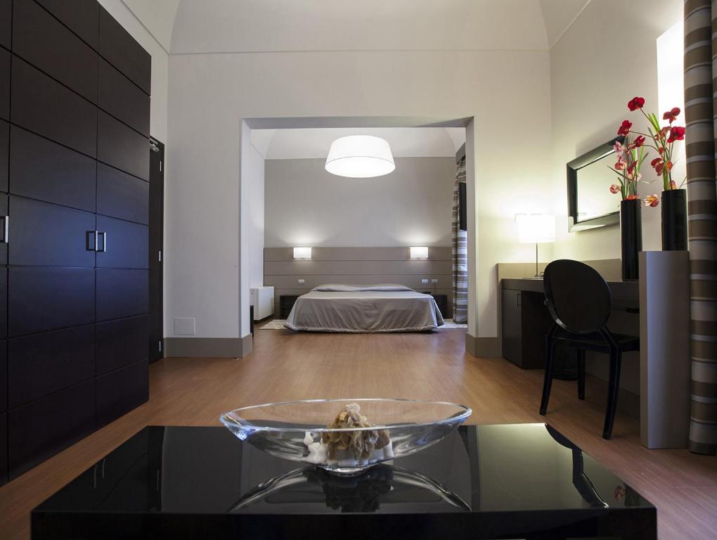 Postel nebo postele na pokoji v ubytování Hotel Vittoria