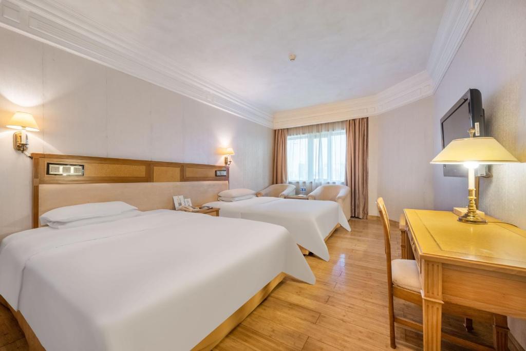 Postel nebo postele na pokoji v ubytování Hotel Silverland