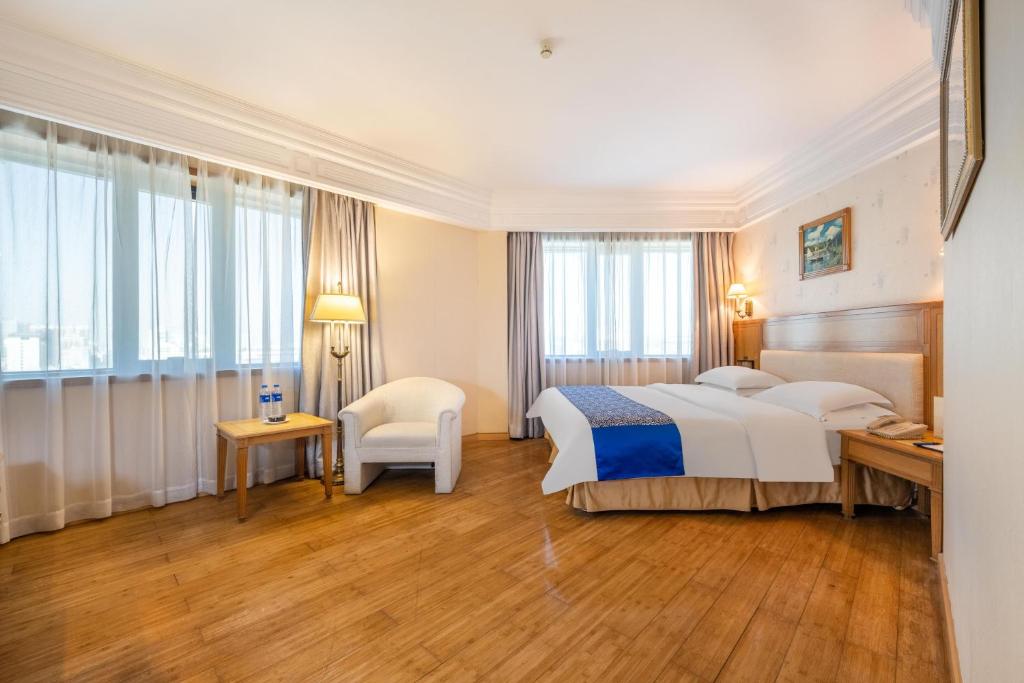 Postel nebo postele na pokoji v ubytování Hotel Silverland