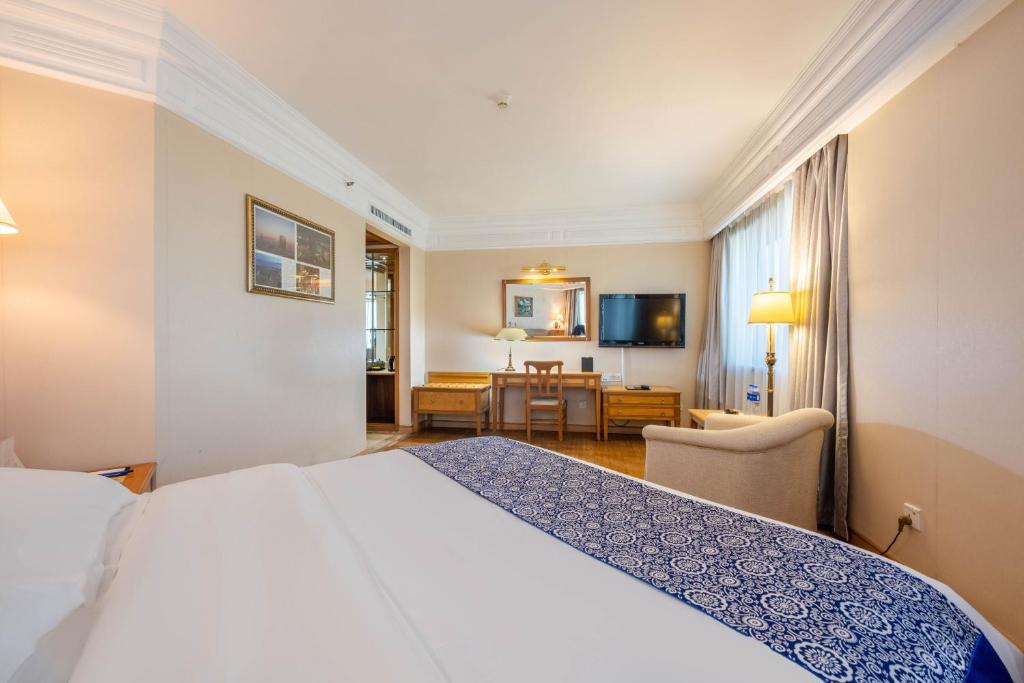 Postel nebo postele na pokoji v ubytování Hotel Silverland
