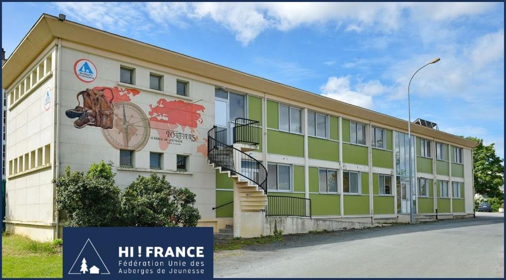 a building with a mural on the side of it at Auberge de jeunesse HI Poitiers in Poitiers