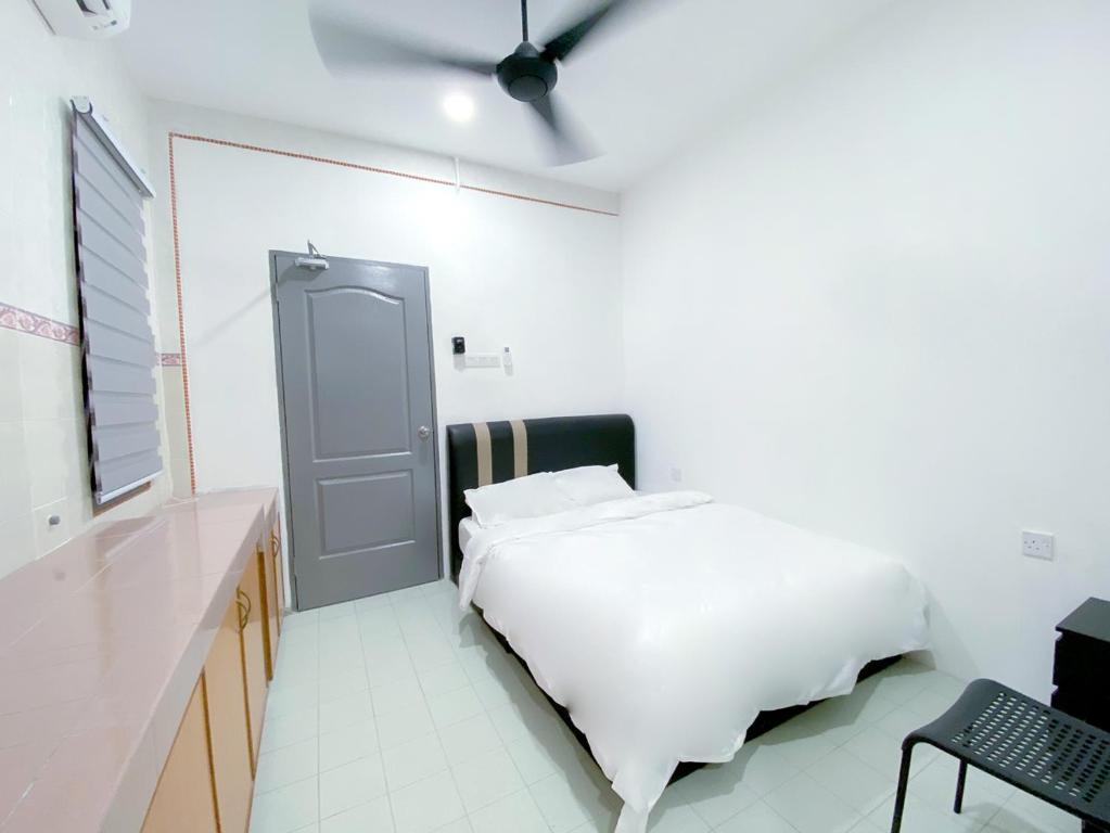 Voodi või voodid majutusasutuse Venice Guest Hostel - Bilik Sahaja toas
