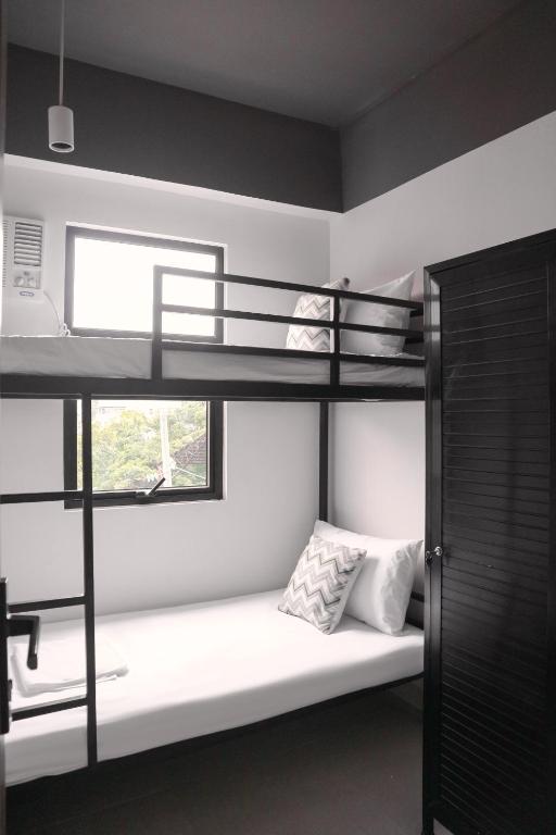 Postel nebo postele na pokoji v ubytování The Grid Co-Living Managed by HII