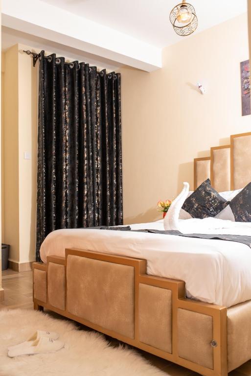 Postel nebo postele na pokoji v ubytování Luxury 1Br Apartment with Secure Parking & Lift Nakuru