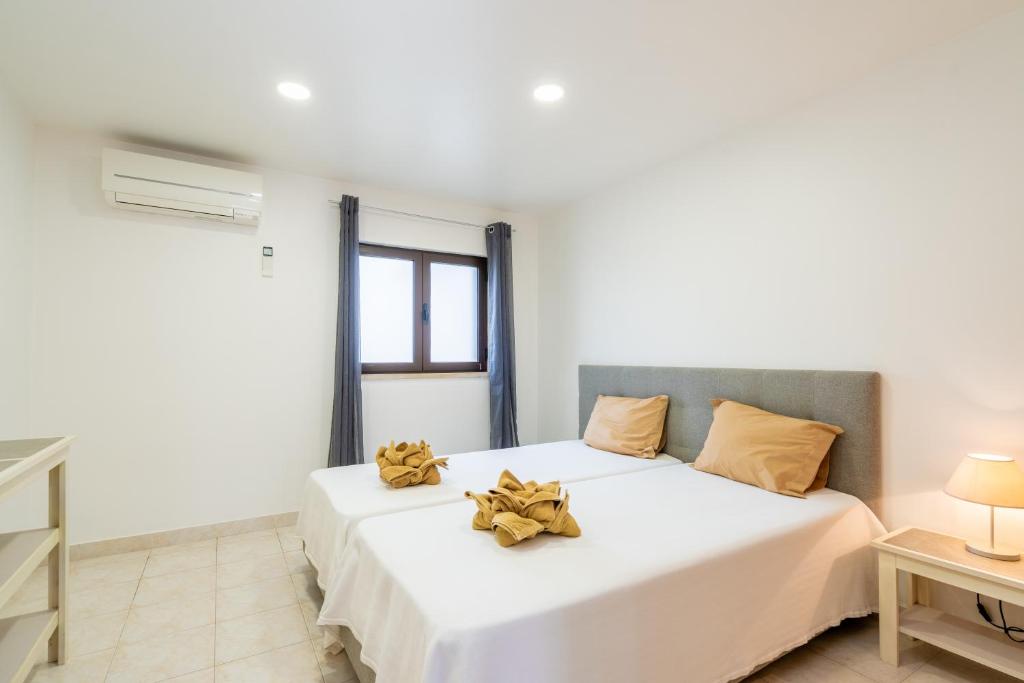 Postel nebo postele na pokoji v ubytování Apartamentos Vale de Carros by Umbral