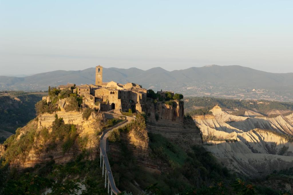 a castle on the top of a mountain at Palazzo Contino in Bagnoregio