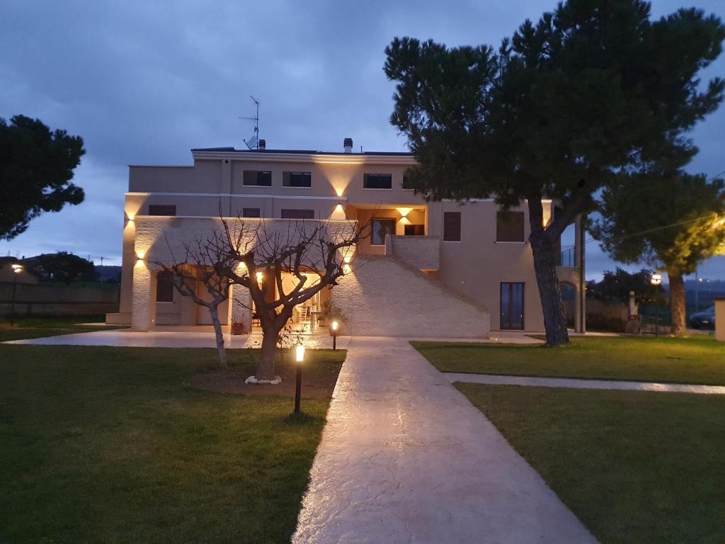 a house with a pathway leading to it at night at Casale Ferrantino in Giulianova