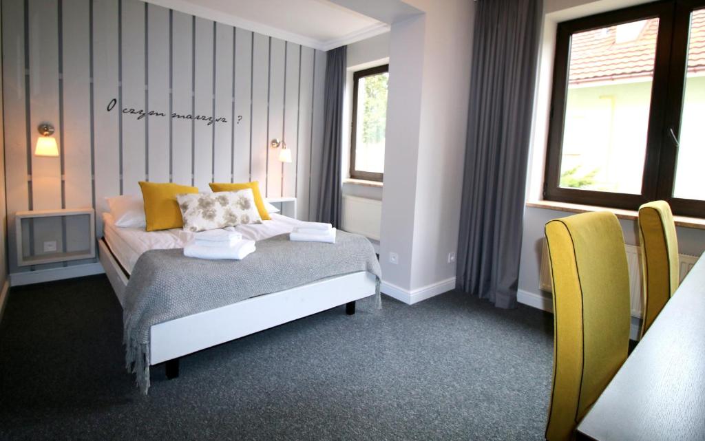 Łóżko lub łóżka w pokoju w obiekcie Hotel Otomin