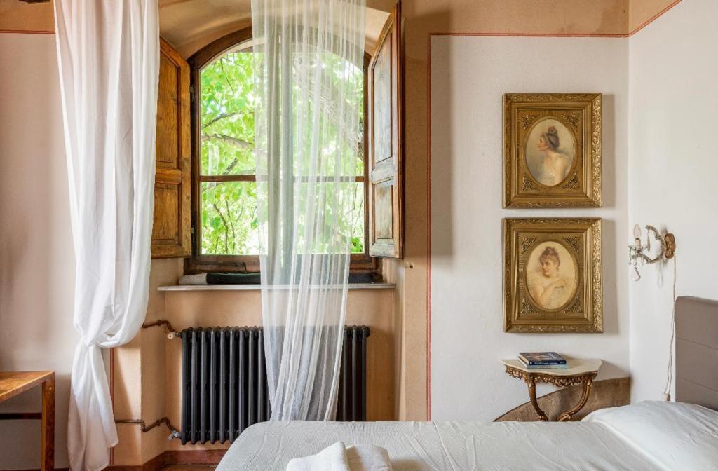 Postel nebo postele na pokoji v ubytování Villa San Filippo