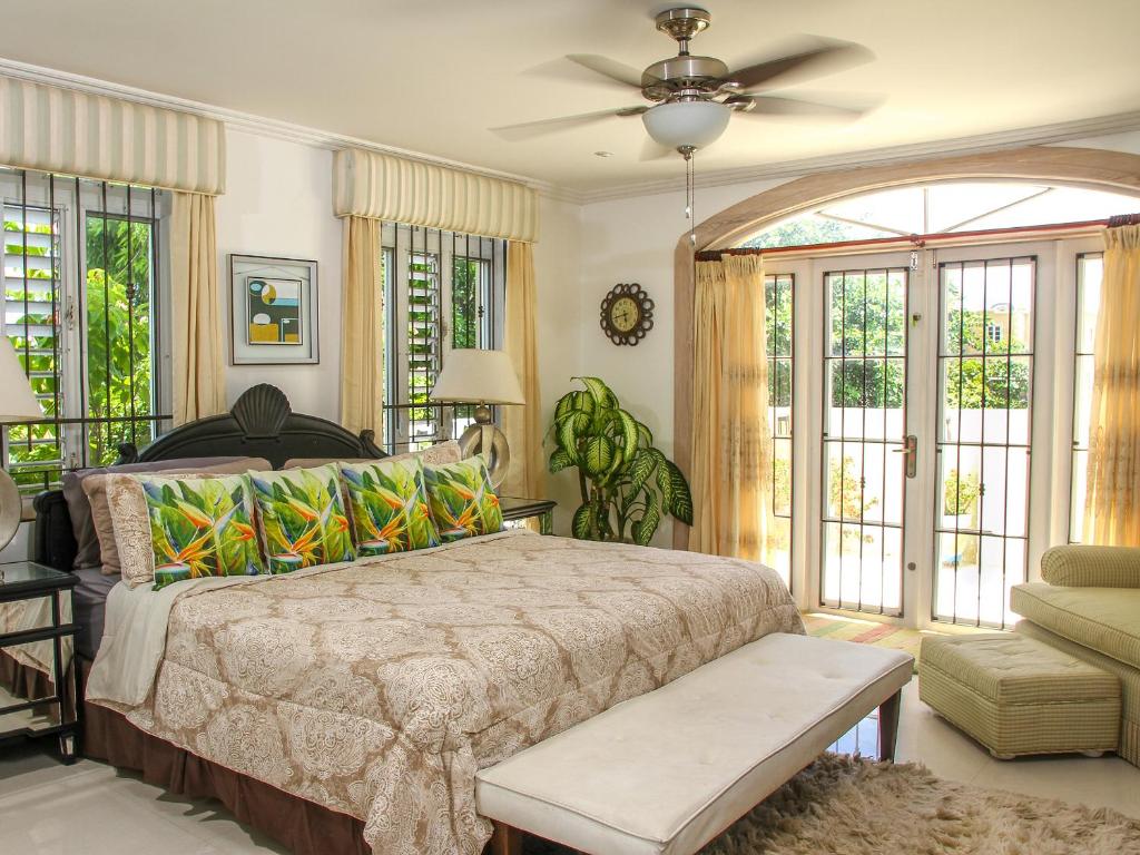 a bedroom with a bed and a ceiling fan at Room in Guest room - Zenbreak Bliss Tranquility in Bridgetown