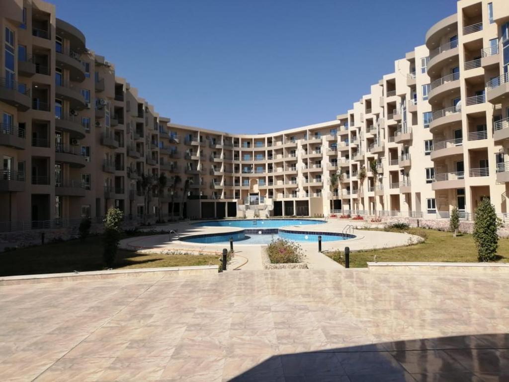 a large apartment building with a large swimming pool at Princess resort unit number 260A Markos in Hurghada
