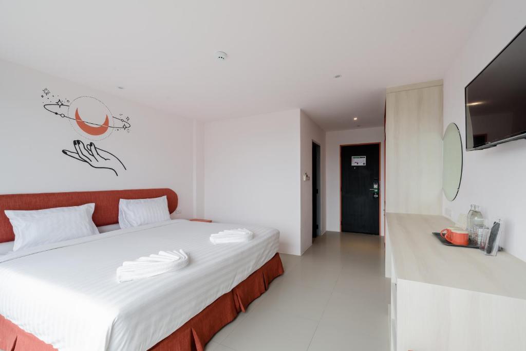 Postel nebo postele na pokoji v ubytování Moon Budget Hotel