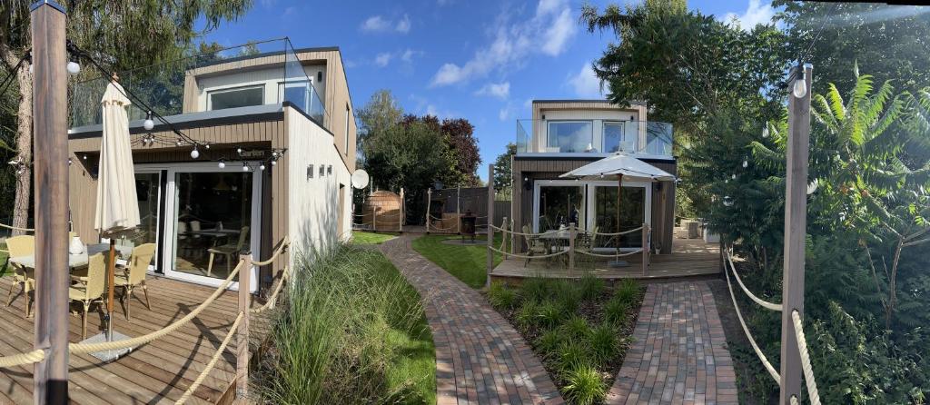 a house with a porch and a patio at Ferienhaus Deluxe in Parey