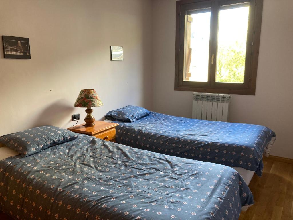 Postel nebo postele na pokoji v ubytování Jarandín 27 - Adosado familiar en Biescas