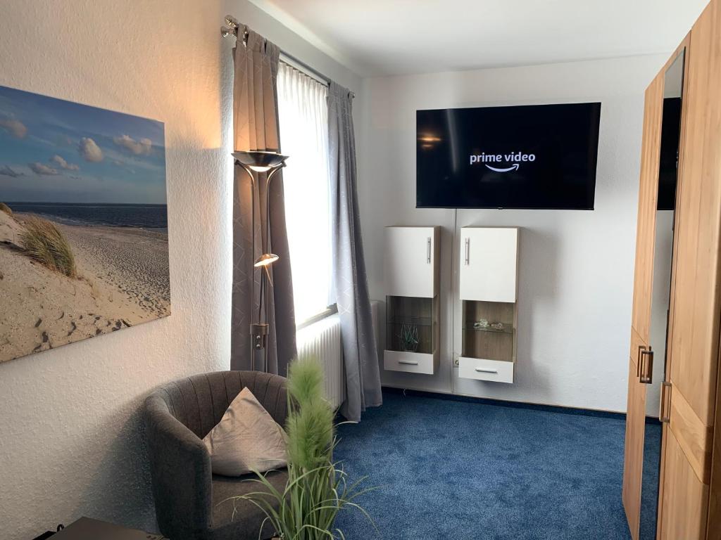 TV a/nebo společenská místnost v ubytování Hotel Meerblick garni