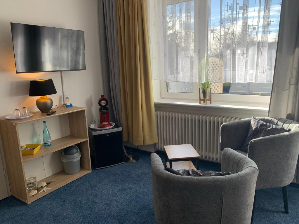 TV a/nebo společenská místnost v ubytování Hotel Meerblick garni