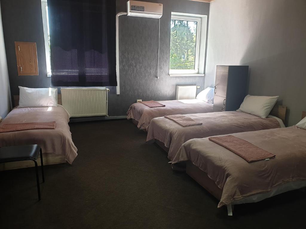 Postel nebo postele na pokoji v ubytování Мандри Хостел