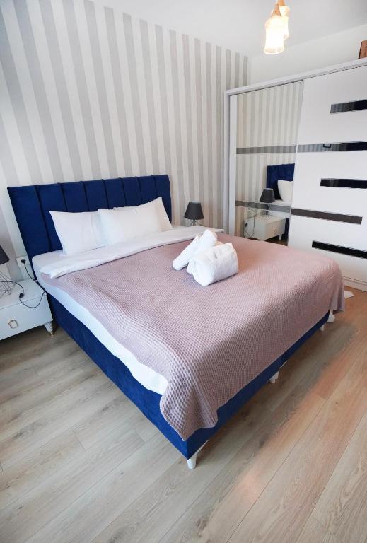 Postel nebo postele na pokoji v ubytování King Suite SS7