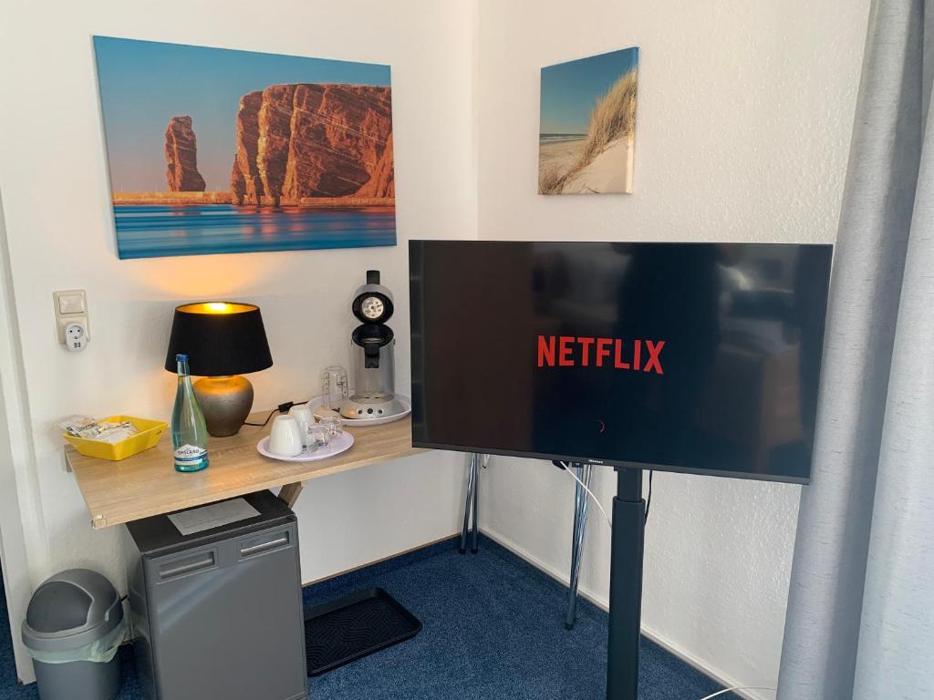 TV a/nebo společenská místnost v ubytování Hotel Meerblick garni