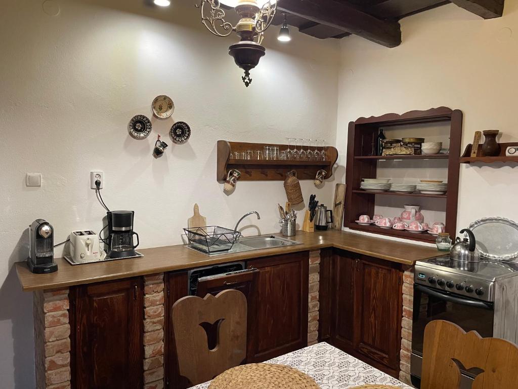 A kitchen or kitchenette at Cziróka Vendégház