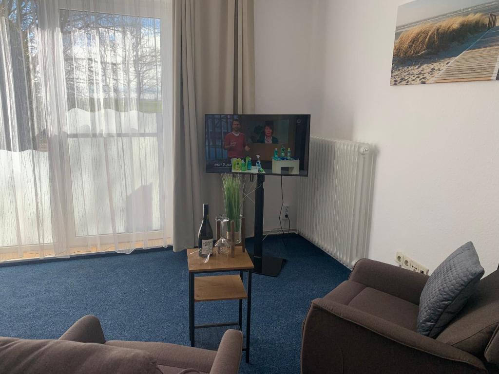 TV a/nebo společenská místnost v ubytování Hotel Meerblick garni