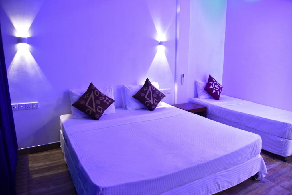 Postel nebo postele na pokoji v ubytování Dinuda Resort