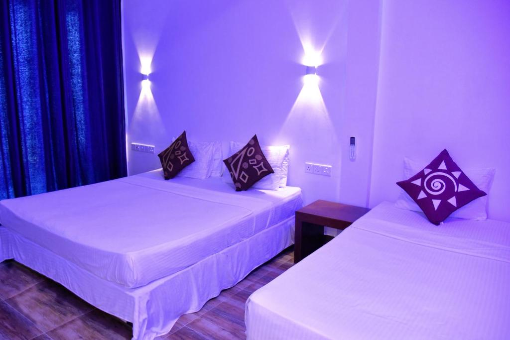 Postel nebo postele na pokoji v ubytování Dinuda Resort