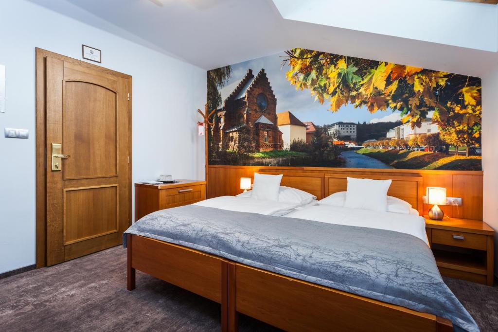 Postel nebo postele na pokoji v ubytování Hotel Jelínkova vila