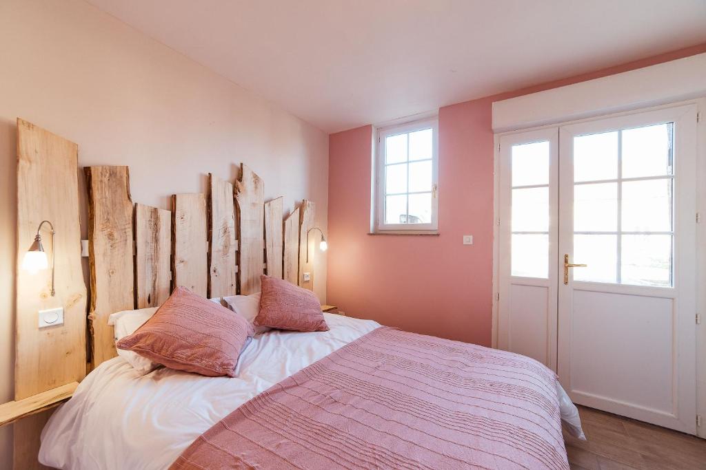 Posteľ alebo postele v izbe v ubytovaní 2 appartements conforts + jardin + parking