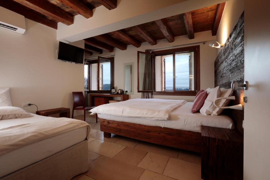 Postel nebo postele na pokoji v ubytování Hotel Antica Abbazia