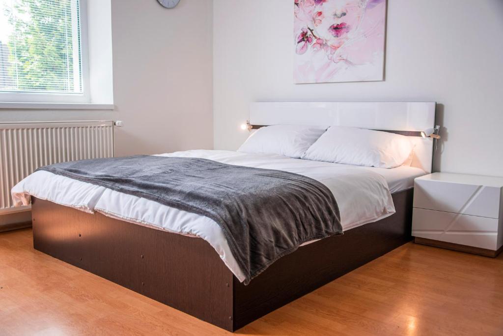 Postel nebo postele na pokoji v ubytování Apartmány EMMA