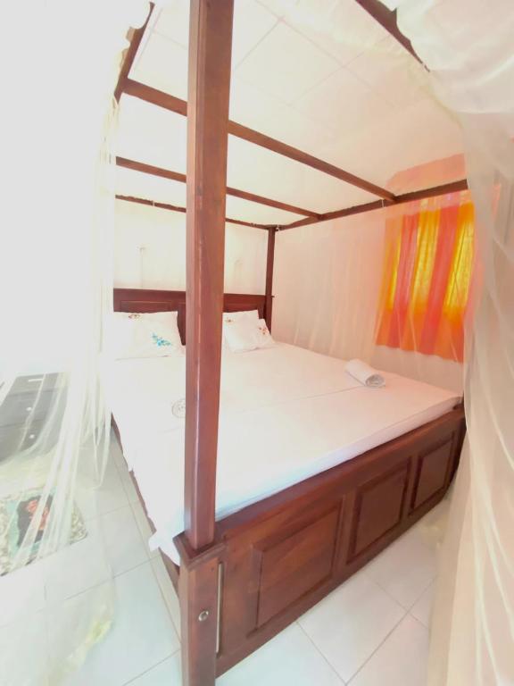 Postel nebo postele na pokoji v ubytování Sanderling Silent Beach Cabanas