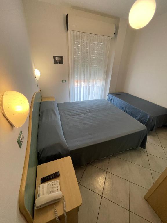 Postel nebo postele na pokoji v ubytování Albergo Désirée 2