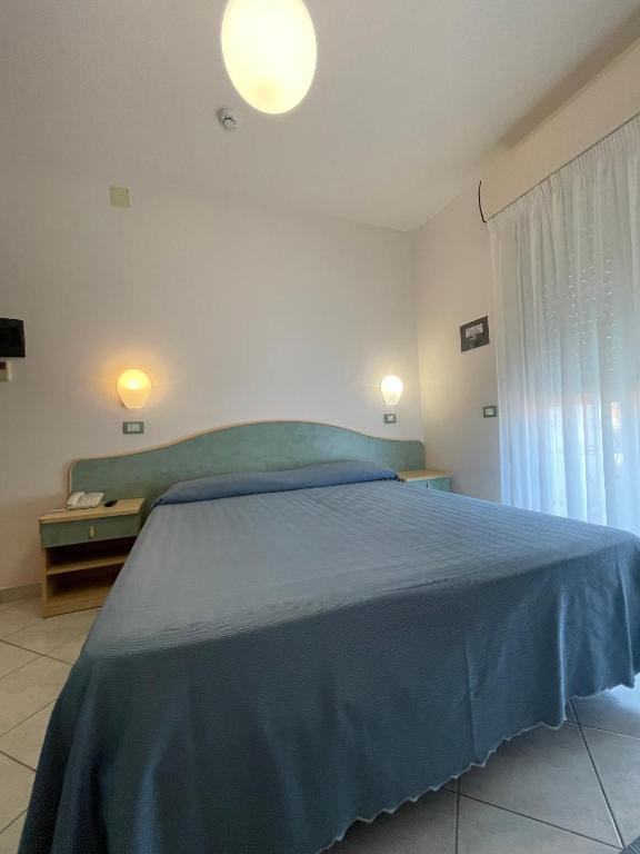 Postel nebo postele na pokoji v ubytování Albergo Désirée 2