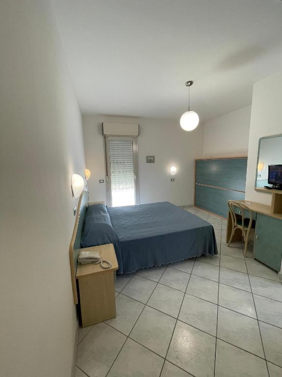 Postel nebo postele na pokoji v ubytování Albergo Désirée 2