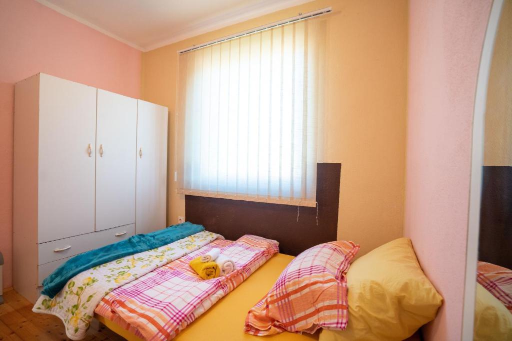 Postel nebo postele na pokoji v ubytování Kuca za odmor Jozic