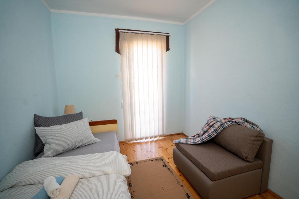 Postel nebo postele na pokoji v ubytování Kuca za odmor Jozic