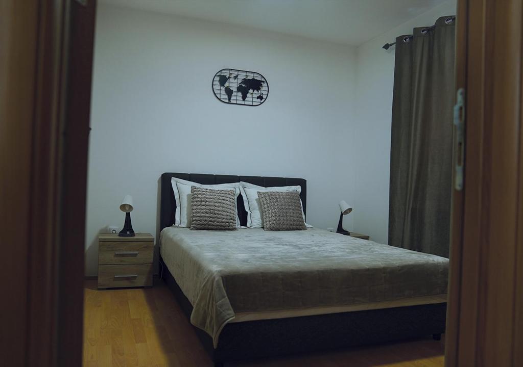 Postel nebo postele na pokoji v ubytování Aster Apartments