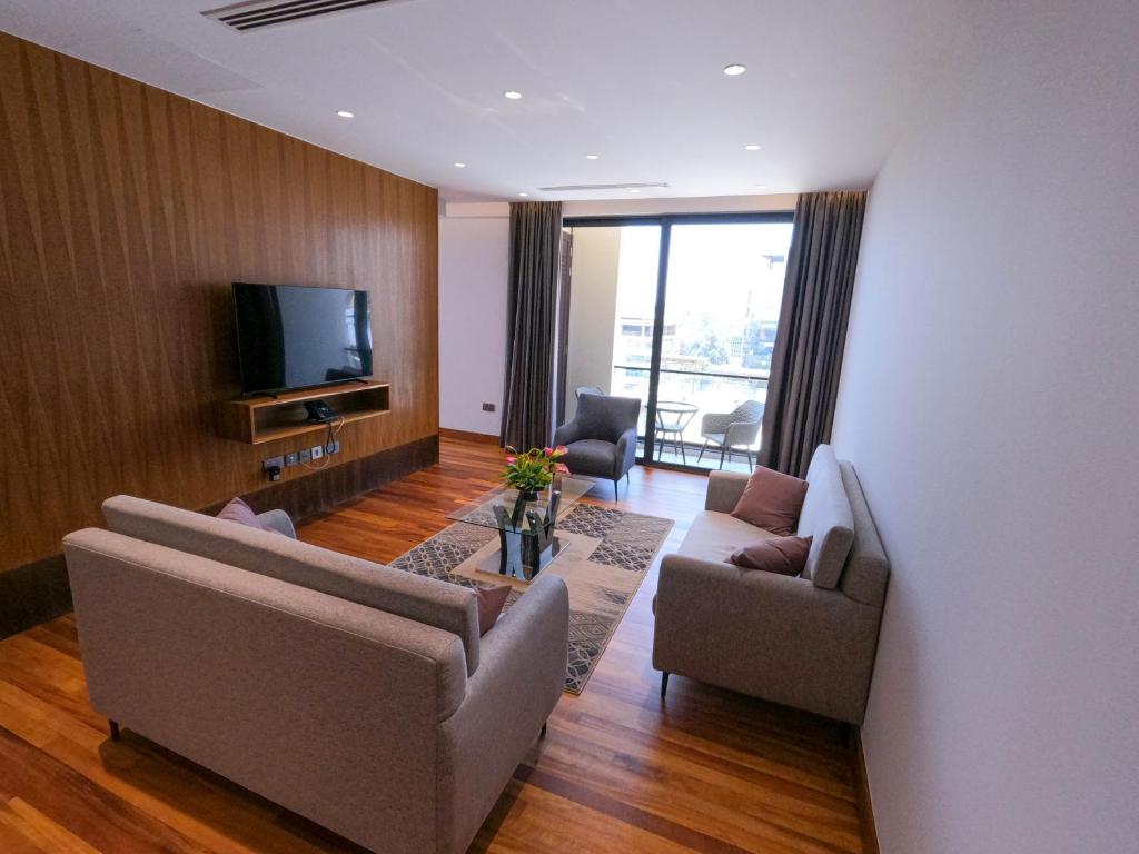 TV a/nebo společenská místnost v ubytování Broadwalk Residency