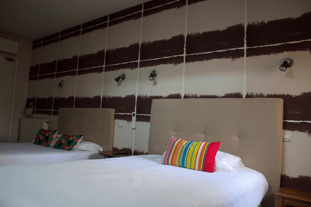 Postel nebo postele na pokoji v ubytování Hôtel Absolu