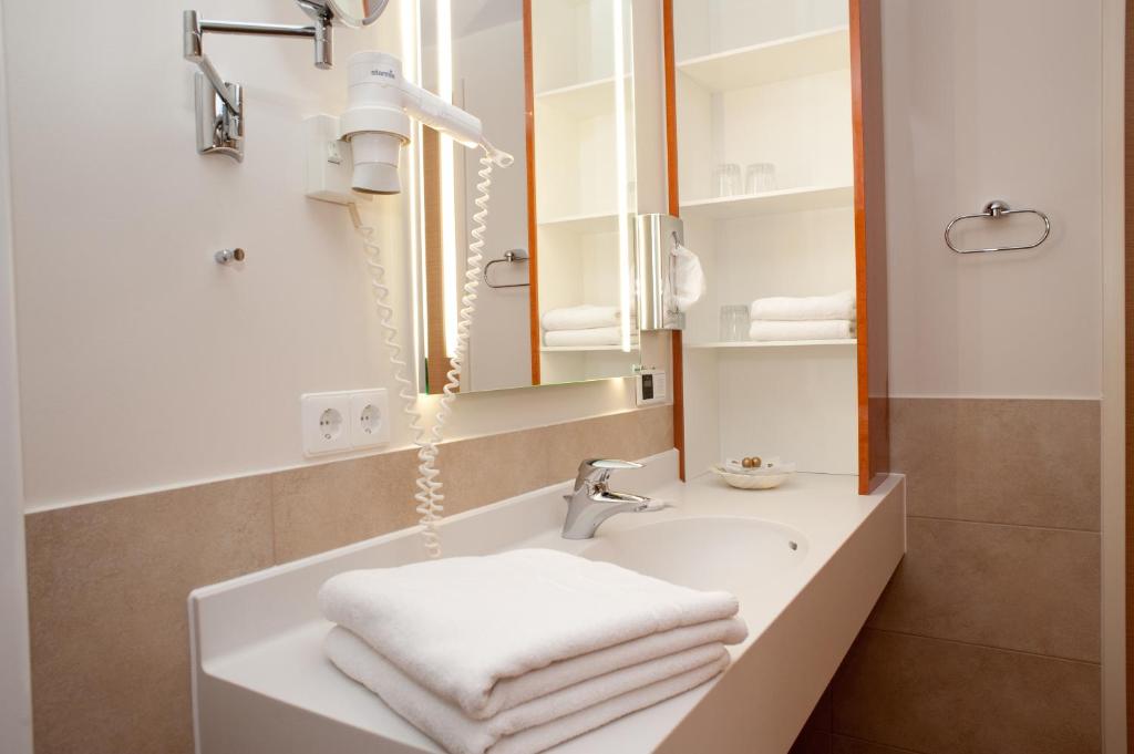 Koupelna v ubytování Janssens Hotel