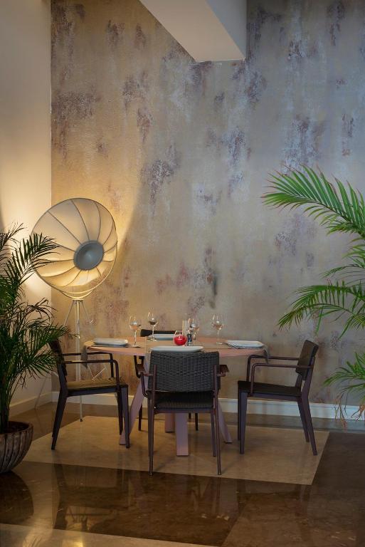 a dining room with a table and two chairs at Prive Hotel Bodrum - Adult Only in Bodrum City