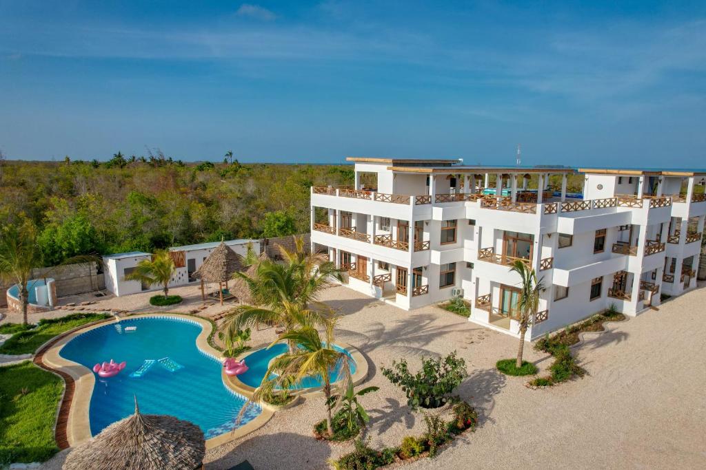 an aerial view of a resort with a swimming pool at Haber Hotel & SPA in Matemwe