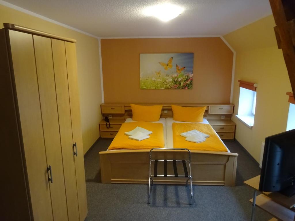 Postel nebo postele na pokoji v ubytování Pension Sigwarth