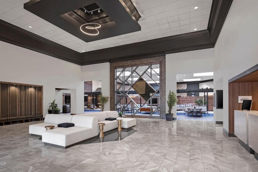 a lobby with couches and tables in a building at Austin Marriott North in Round Rock