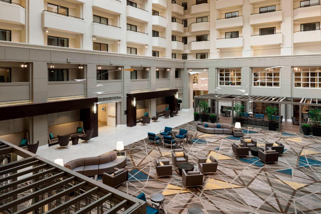 an empty lobby of a hotel with couches and chairs at Fairfax Marriott at Fair Oaks in Fairfax