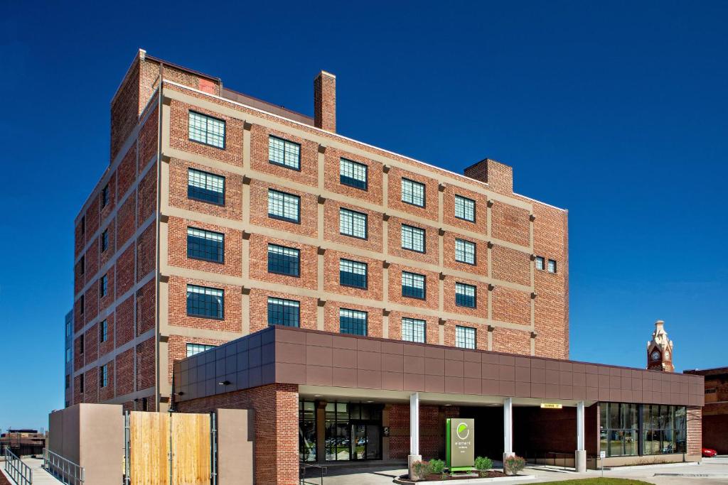 a large brick building on a street at Element Moline in Moline