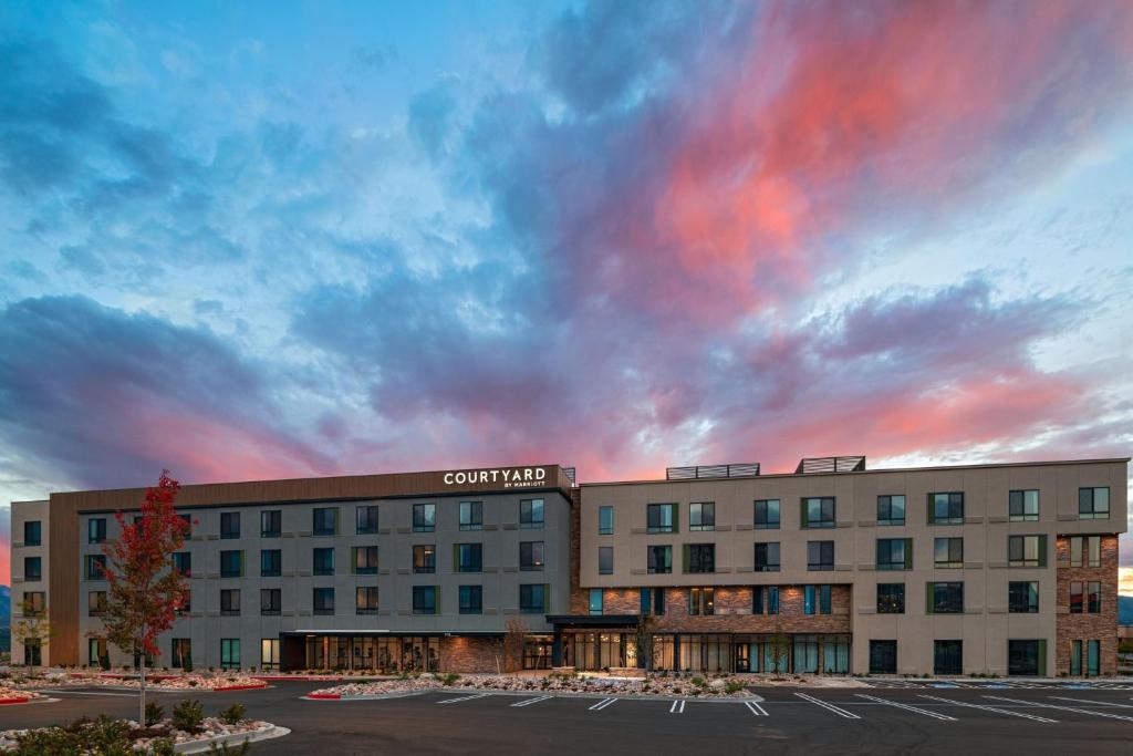 a rendering of a hotel with a cloudy sky at Courtyard by Marriott Colorado Springs North, Air Force Academy in Colorado Springs
