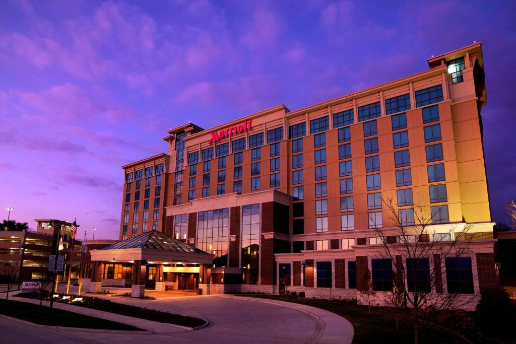 a hotel building with a sign on top of it at Marriott Bloomington Normal Hotel and Conference Center in Bloomington